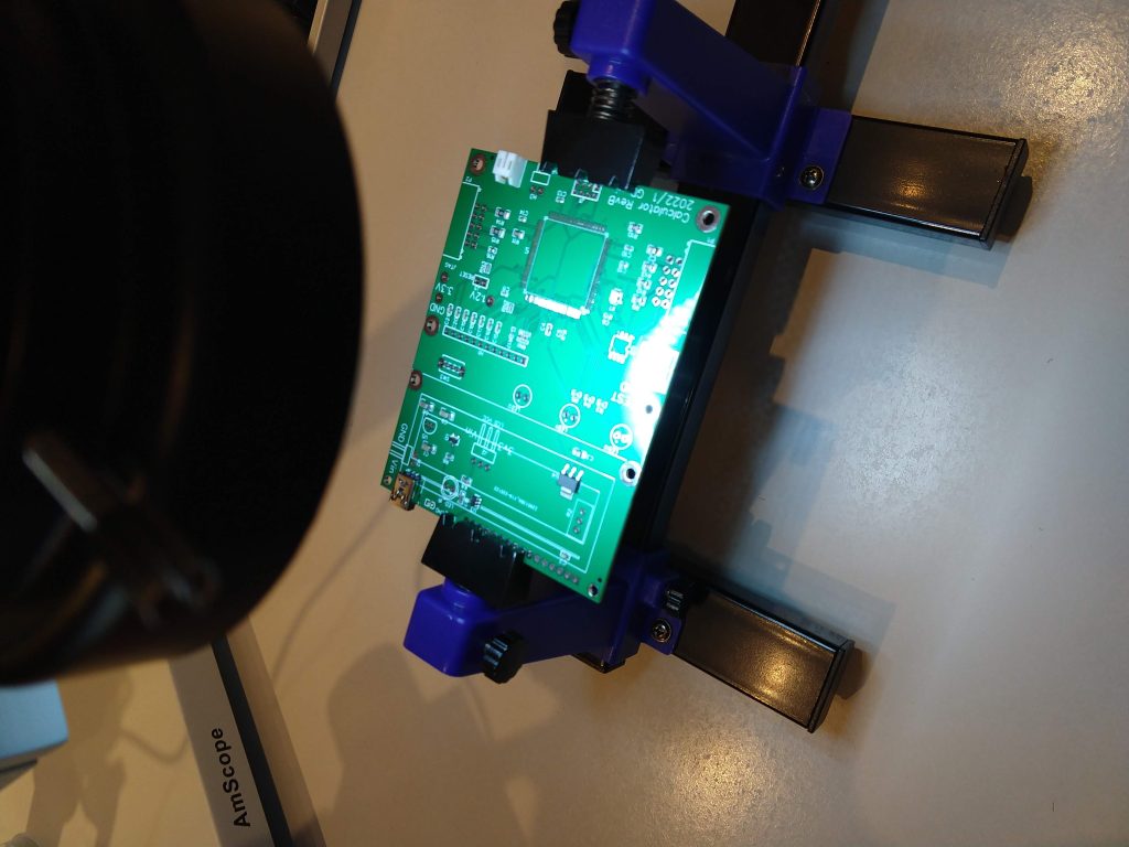 Soldering FPGA main board under microscope