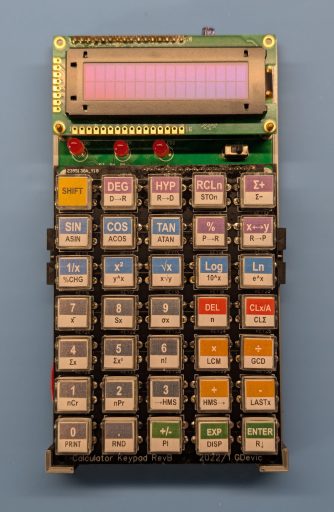 The finished calculator. Custom CPU, 16-digit BCD arithmetic, 35 keys, OLED display. Designed and built from scratch.