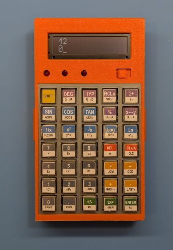 The finished calculator. Custom CPU, 16-digit BCD arithmetic, 35 keys, OLED display. Designed and built from scratch.